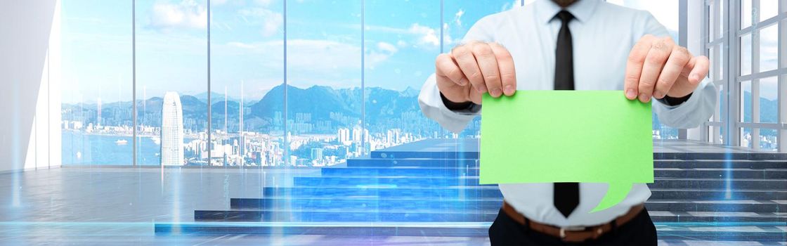 Man Wearing Black Tie Holding Chat Box Around Futuristic Technology.