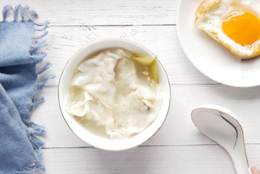 Dumpling Soup in a bowl on table