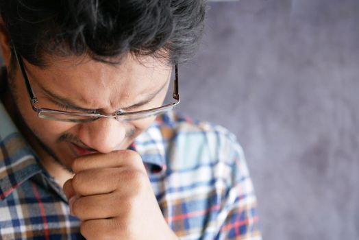 Portrait of sick man sneezes and coughs,