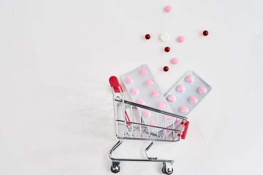 drug trolleys pharmacy shopping light background pharmacy. High quality photo