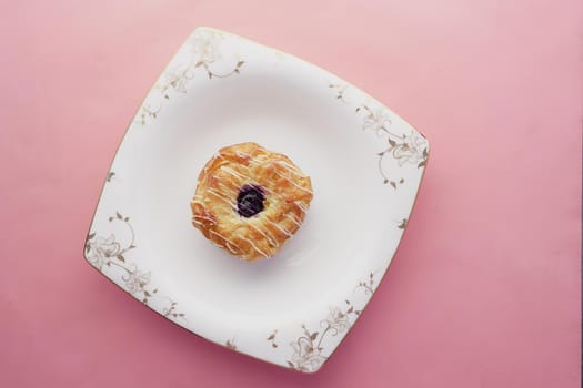 chocolate donuts on plate with copy space.