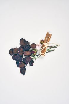 rose petals decoration cinnamon object light background. High quality photo