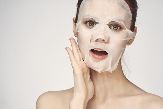 pretty woman naked shoulders face mask close-up skin care. High quality photo