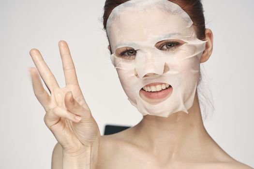 pretty woman naked shoulders face mask close-up skin care. High quality photo