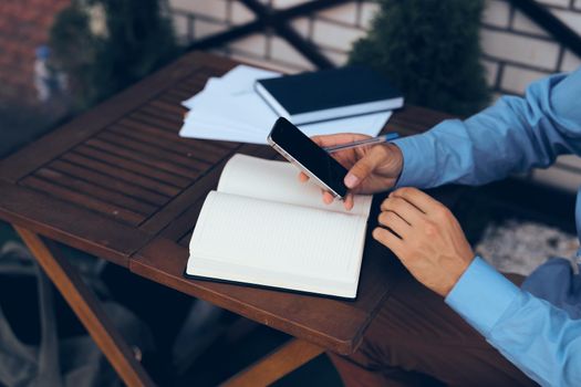 business man in a summer cafe work communication technology. High quality photo