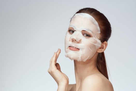 pretty woman naked shoulders face mask close-up skin care. High quality photo