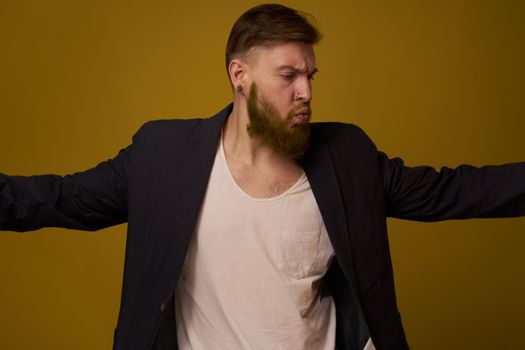 bearded man fashionable hairstyle jacket posing self confidence. High quality photo
