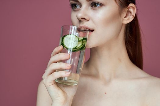 pretty woman with cucumber drink vitamins health beauty. High quality photo