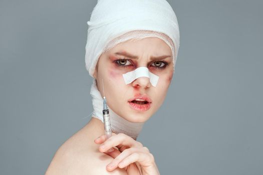 female patient bandaged face health problems close-up. High quality photo