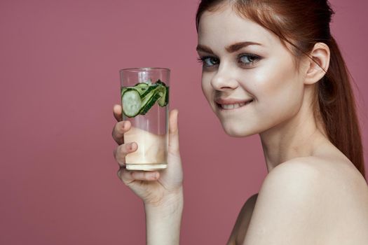 pretty woman with cucumber drink vitamins health beauty. High quality photo