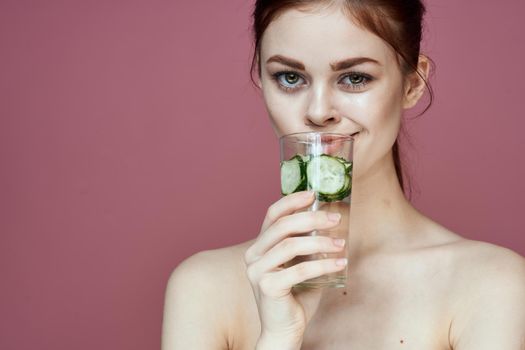 pretty woman with cucumber drink vitamins health beauty. High quality photo