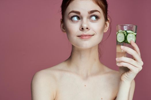 pretty woman with cucumber drink vitamins health beauty. High quality photo