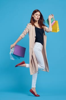 pretty woman with packages in hands Shopaholic isolated background. High quality photo