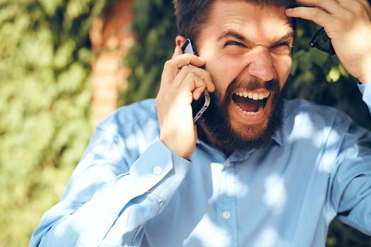 manager talking on the phone on the street technology. High quality photo