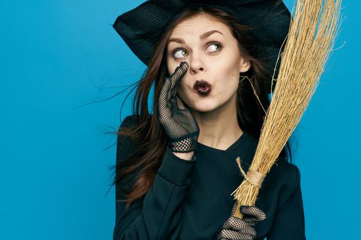 woman with broom Witch costume Halloween holiday mystic. High quality photo