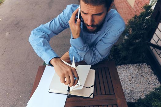 bearded man work documents technology manager in cafe. High quality photo