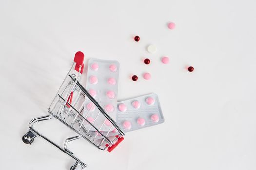 drug trolleys pharmacy shopping light background pharmacy. High quality photo