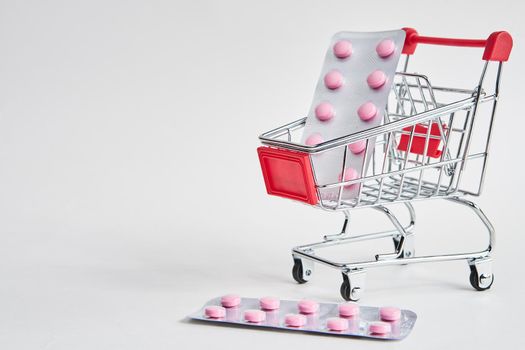 drug trolleys pharmacy shopping light background pharmacy. High quality photo