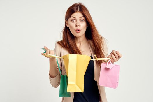 glamorous woman with packages in hands Shopaholic isolated background. High quality photo