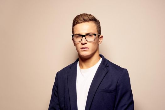 portrait of a man fashion posing with glasses isolated background. High quality photo