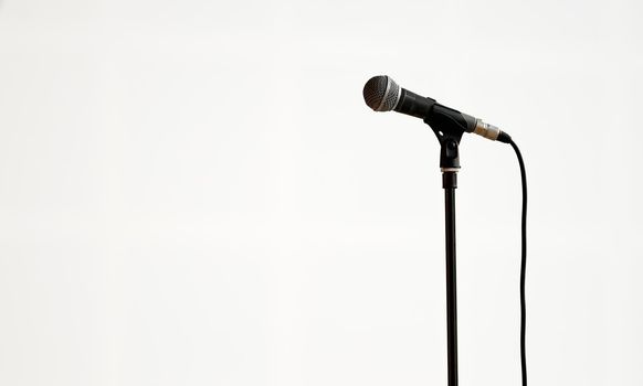 concert microphone on a drain on a white background in the hall in isolation . High quality photo