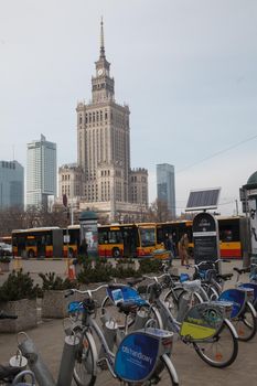 WARSAW, POLAND - Mar, 2018 Palace of Culture and Science with bikes and bus on the foreground - public transportation