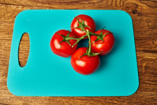 vegetables kitchen cooking salad red tomatoes wood background. High quality photo