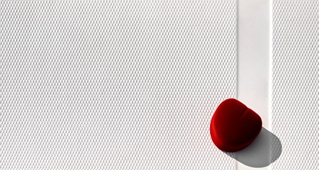 Closed red velvet heart shaped ring box isolated on white textured background. Marriage proposal concept. High quality photo