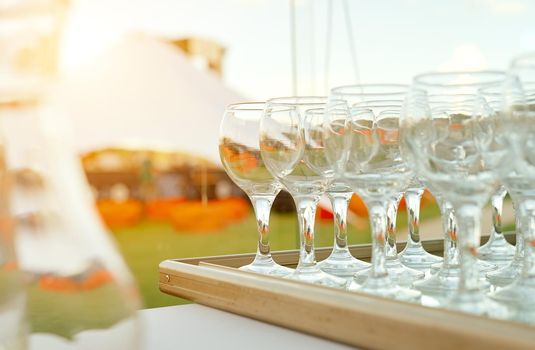 vine glasses on tray nature park catering. High quality photo