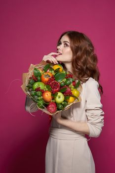 pretty woman fun posing fruit bouquet vitamins isolated background. High quality photo