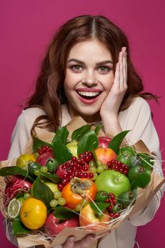 portrait of a woman smile posing fresh fruits bouquet emotions Studio Model. High quality photo