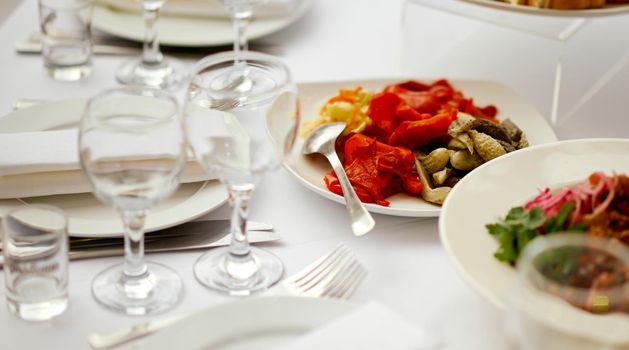 Catering. served table with an emphasis on pickled vegetables cucumbers and peppers . High quality photo