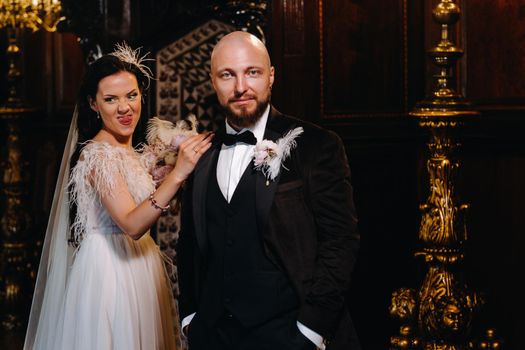 Elegant wedding couple in the interior of the old castle in the city of Nesvizh.