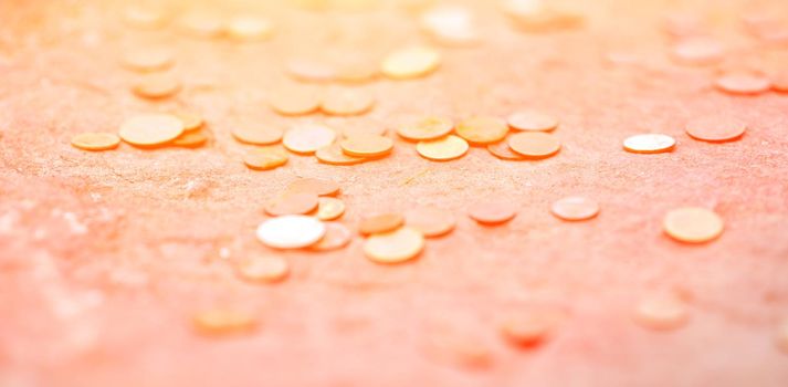 lots of coins. scattered on the ground at sunset. Placer. Thrown. High quality photo