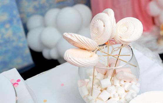 Homemade candies meringue on stick Meringue candy on wooden stick in vase on party. High quality photo