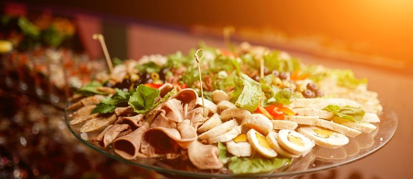 glass tray on a stand with meat and boiled chopped eggs . High quality photo