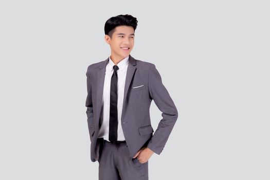 Portrait young asian businessman in suit with confident and friendly isolated on white background, business man smart with success hand in pocket, manager or executive with handsome and leadership.