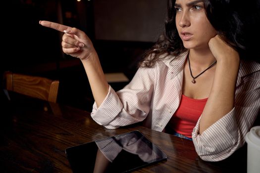 woman sitting in a cafe with a laptop coffee cup vacation. High quality photo