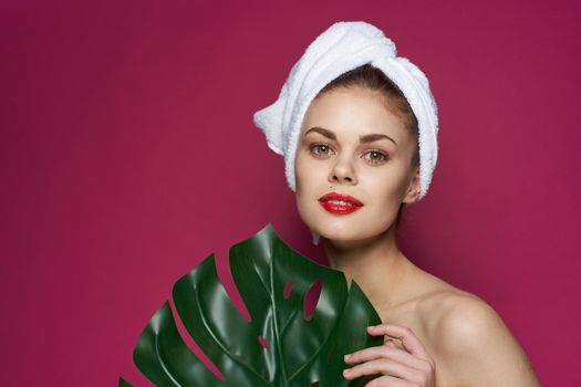 attractive woman bare shoulders red lips posing pink background. High quality photo