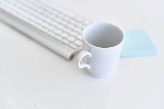 wireless keyboard on desktop cup documents office. High quality photo
