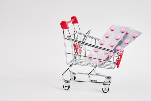 drug trolleys pharmacy shopping light background pharmacy. High quality photo