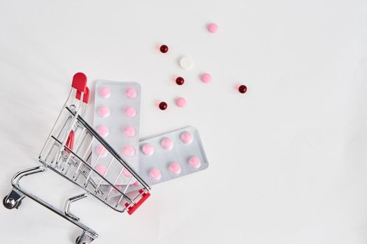 drug trolleys pharmacy shopping light background pharmacy. High quality photo