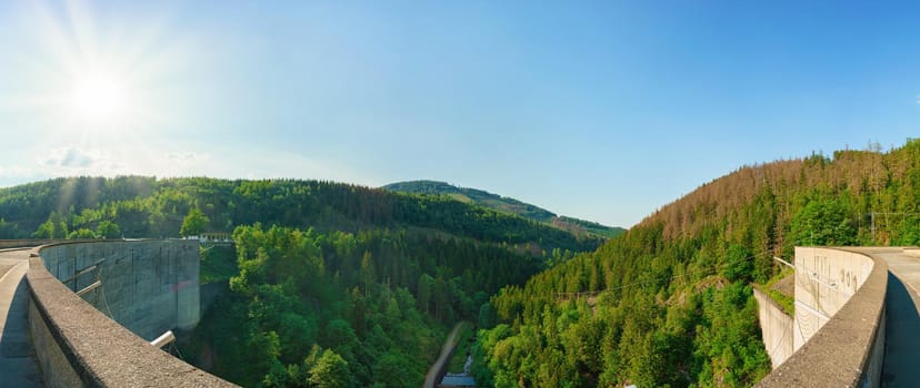 Panorama view of a dam in Germany in summer with blue sky an