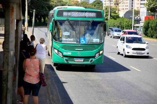 salvador, bahia, brazil - july 20, 2021: passengers are seen waiting for public transport buses at a bus stop in the city of Salvador.