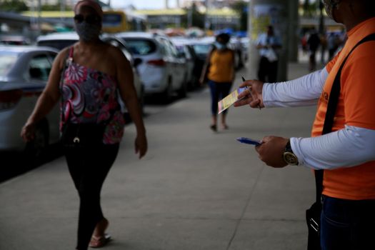 salvador, bahia, brazil - july 20, 2021: person making distribution of service disclosure pamphlet on the street in the city of Salvador.