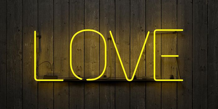 neon sign with the word "LOVE" with yellow light on a gray wood wall. 3d render