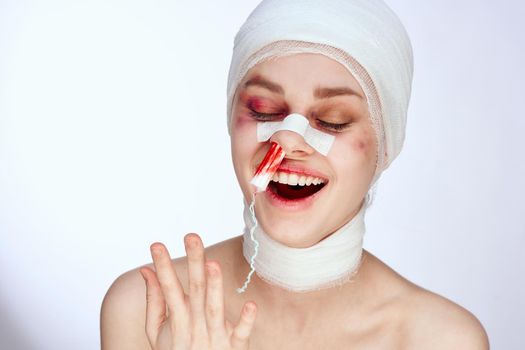 a person tampon in the nose with blood injured face close-up. High quality photo