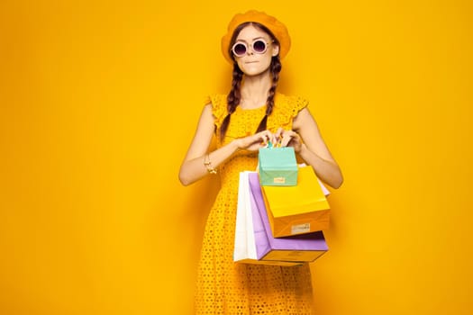 pretty woman wearing sunglasses posing shopping fashion isolated background. High quality photo