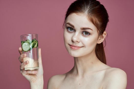 pretty woman with cucumber drink vitamins health beauty. High quality photo