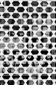 Alicante, Spain- October 9, 2021: Closed shop showcase blind pattern. Monochrome picture.